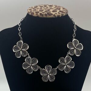 Silver filigree flower statement necklace.